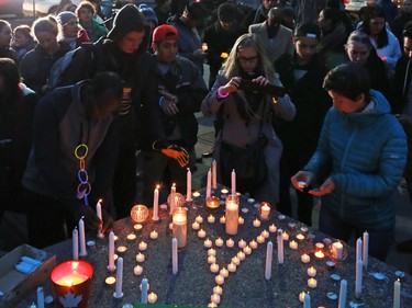 Calgarians attend a candlelight vigil for the victims of the terrorist attack in Paris. The vigil took place outside City Hall in Calgary on Saturday night November 14, 2015.