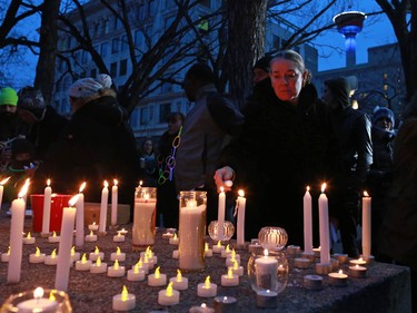 Calgarians attend a candlelight vigil for the victims of the terrorist attack in Paris. The vigil took place outside City Hall in Calgary on Saturday night November 14, 2015.