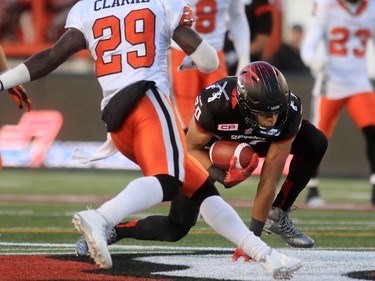 Calgary Stampeders receiver Eric Rogers gets by the B.C. Lions Steven Clarke during the second half of the CFL's West Division semifinal at McMahon Stadium. Calgary