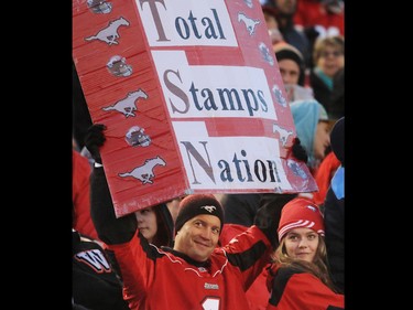 Calgary Stampeders fans celebrate as their team defeated the B.C. Lions 35-9 in the CFL's West Division semifinal at McMahon Stadium.