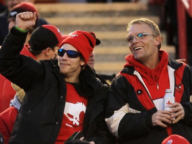 Calgary Stampeders fans celebrate as their team defeated the B.C. Lions 35-9 in the CFL's West Division semifinal at McMahon Stadium.
