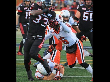 Calgary Stampeders running back Jerome Messam runs the ball in for a touchdown during the first half of the CFL's West Division semifinal against the B.C. Lions at McMahon Stadium.