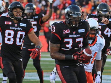 Calgary Stampeders running back Jerome Messam runs the ball in for a touchdown during the first half of the CFL's West Division semifinal against the B.C. Lions at McMahon Stadium.