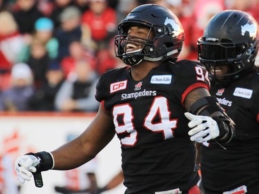 The Calgary Stampeders Frank Beltre celebrates sacking B.C. Lions quarterback Jonathan Jennings during the first half of the CFL's West Division semifinal at McMahon Stadium on Sunday November 15, 2015