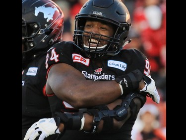 The Calgary Stampeders Frank Beltre celebrates sacking B.C. Lions quarterback Jonathan Jennings during the first half of the CFL's West Division semifinal at McMahon Stadium on Sunday November 15, 2015