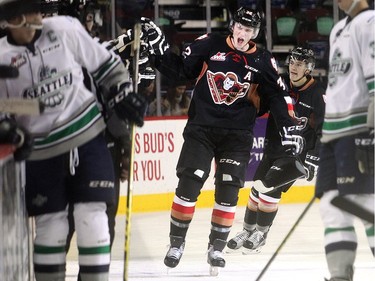 Travis Sanheim of the Calgary Hitmen slaps hands at the bench after his second period goal against the Seattle Thunderbirds in WHL action at the Saddledome Sunday November 1, 2015.