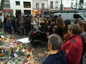 A Calgary contingent of the Billy Graham Rapid Response Team is in Paris to help mourners cope with their grief. This photo was taken at a vigil outside the Belle Equipe restaurant.