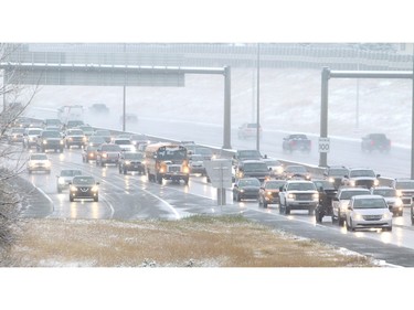 Traffic crawls along Deerfoot Trail South at Douglasdale Boulevard as the first snowfall of the season snarls the Monday morning commute November 2, 2015.