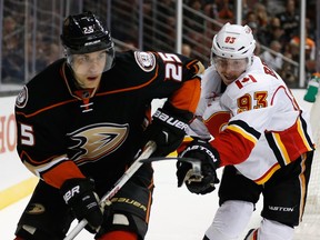 Sam Bennett of the Calgary Flames, right, hits Mike Santorelli of the Anaheim Ducks with his stick during Tuesday's game. Bennett has 10 points on the road this season, topping the Flames.