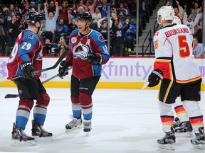 Jarome Iginla of the Colorado Avalanche celebrates his first of two goals against his old team, the Calgary Flames, with teammate Nathan MacKinnon on Tuesday night. The Avs blew open the game in the third period to win 6-3.