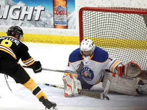 Alberta goalie Carl Stankowski repels Manitoba's Riley Bettens during Sunday's final of the Western Canada Challenge Cup U16 hockey tournament at Markin MacPhail Centre. Alberta won 3-0.