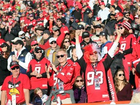 Fans celebrate a touchdown as the Calgary Stampeders hosted the B.C. Lions in the CFL's West Division semifinal on Nov. 15 at McMahon Stadium. Reader says fan turnout may be smaller because people who lose their jobs don't spend money on tickets for games.