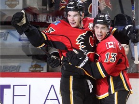 Calgary Flames Sean Monahan, left, celebrates his goal on Chicago Blackhawks with teammate Johnny Gaudreau during their game at the Scotiabank Saddledome in Calgary on November 20, 2015.