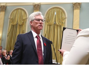 Canada's new Natural Resources Minister Jim Carr is sworn in during a ceremony at Rideau Hall in Ottawa on Nov. 4, 2015.