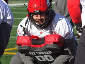 Dimitri Tsoumpas practises with the Stamps on Wednesday. The former CFL all-star insists he's not coming out of retirement, rather just joining the team to help with scout work at practice.