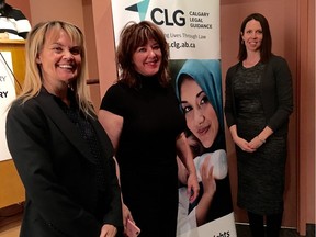 Margaret Keelaghan (middle), senior managing counsel at Calgary Legal Guidance, with immigration lawyers Kerry Cundal (left) and Kari Schroeder (right) present at an information session on sponsoring refugees at the Calgary Public Library's John Dutton Theatre on Saturday, November 28, 2015.
