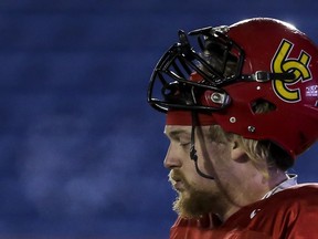 U of C Dinos offensive lineman Braden Schram exhales into the below zero temperature air during practice at McMahon Stadium earlier this week. The Manning, Alta. product is used to the hard work it takes to excel in football; in high school he and three others drove an hour each way every day just to get to practice in Peace River.