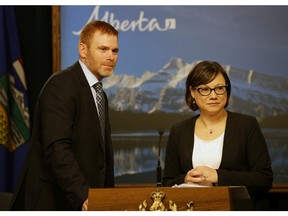Alberta Environment Minister Shannon Phillips (right) and University of Alberta economist Andrew Leach (left).