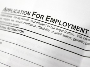 An employment application form on a table during a job fair at Columbia-Greene Community College in Hudson, N.Y.