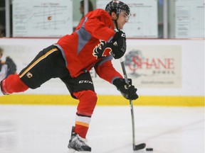 Kenny Agostino takes a shot on net during Calgary Flames practice at WinSport in Calgary on Sunday, Sept. 20, 2015.