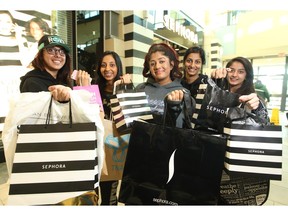 Calgary shoppers, from left, Harinder Bagri, Jaspreet Sidhu, Priya Mahey, Navpreet Sidhu and Nikki Bagri showed off their early morning haul from stores at CF Chinook Centre during the Black Friday sale.