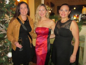 From left: Rochelle Cote of Rochelle Cote Interior Design; Ana Cummings of ANA Interiors; and Alana Gaulin at Lougheed House Christmas party Nov. 20, 2015. A variety of guests, including several from the Lougheed family, were on hand to celebrate the spectacular decorating at the stately mansion. The evening included highlights from The Christmas Carol theatre production and Calgary Opera Emerging Artists Ensemble as well as a silent auction to raise funds to support education programs at the historic site.