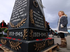 Calgarians placed poppies around the cenotaph at the Military Museums following the 2015 Remembrance Day ceremonies.