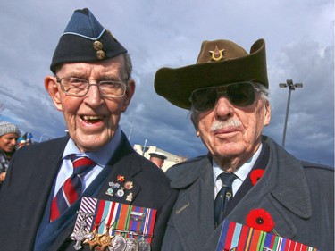 RCAF veterans Doug Morison, 93, left, and Bryce Chase, 92, attend the Remembrance Day service at the Military Museums on Nov. 11, 2015. Morison is also a recipient of the Distinguished Flying Cross.