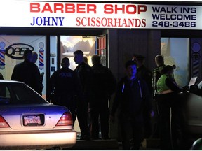 Police deal with a fatal shooting in a strip mall at 20th avenue and 52nd street S.E. on Saturday night November 14, 2015.