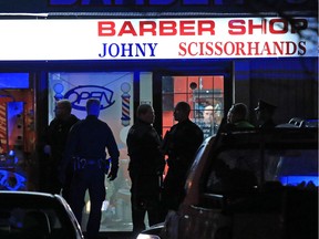 Police deal with a fatal shooting in a strip mall at 20th avenue and 52nd street S.E. on Nov. 14, 2015.
