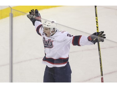 Regina Pats Jake Leschyshyn celebrates after he pockets the winning overtime goal during game action against the Calgary Hitmen at the Saddledome in Calgary, on November 27, 2015.