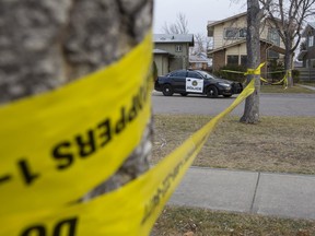 Police tape off an area on Midglen Way S.E., after a home invasion Thursday morning.