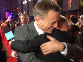 Daniel Craig, a.k.a James Bond, hugs his biggest fan, eight-year-old Britton Walker of Calgary.