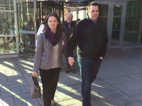 Jen and Dan Wolfsmith leave Calgary court on Nov. 16 after dayhome
operator Caitlin Jarosz pleads guilty to manslaughter in the death of their 21-month-old daughter Mackenzy on May 2, 2012.