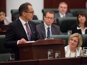 Alberta Premier Rachel Notley, right, looks on as Finance Minister Joe Ceci presents the release of the 2015 provincial budget to the Legislative Assembly in Edmonton on Tuesday, Oct. 27, 2015.