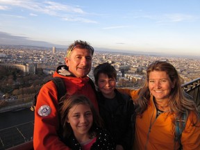 Jorg and Heather Wilz with their children atop the Eiffel Tower in Paris. The family was in the French city during the terrorist attacks on Friday.