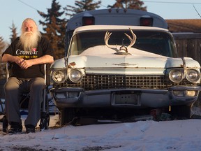 Kelly Jay, the former singer with iconic 70s Canadian rock band Crowbar, in his walker beside the Cadillac in his Penbrooke Meadows driveway  on Wednesday, Nov. 25.