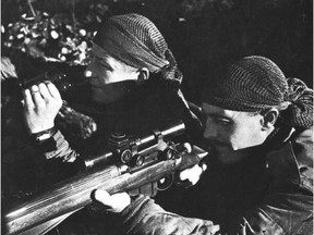 Cpl. Steven Kormendy, left, and Sergeant Harold Marshall of the Calgary Highlanders sniper unit pose for photographer Ken Bell in Belgium on 
Oct. 6,  1944.  Kormendy had been wounded on Aug. 26, 1944; Marshall would be hit on Dec. 15th.