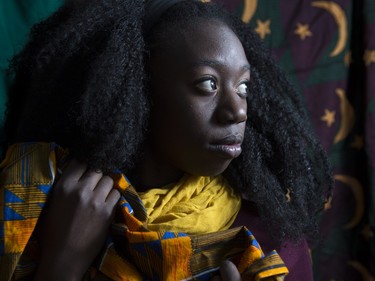 Makambe Simamba, a Zambian born artist, poses in her home studio in Calgary, on November 20, 2015, holding and surrounded by chitenges, which are East African fabric similar to a sarong and which are also the namesake of Simamba's one woman play, A Chitenge Story, which debut's in Calgary, on Sunday November 22, 2015.