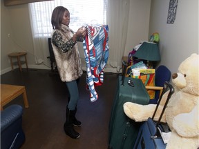 Beryl folds her children's clothes as she looks towards a new future on her last day at Alcove Addiction Recovery for Women, formerly Youville, Wednesday November 18, 2015. She had just completed the 12-week recovery program.