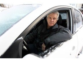 Calgary Uber driver Don Carruthers in the car he purchased to drive for  Uber, but has been forced to park following a court ruling last week. Carruthers was photographed on Nov. 24, 2015.