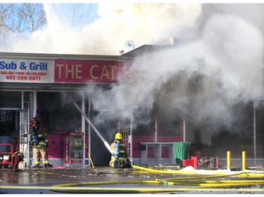 Members of the Calgary Fire Department worked to extinguish a two alarm fire at the Stadium Shopping Centre on Nov. 12, 2015. At least four businesses were heavily damaged by fire while others in the mall sustained smoke and water damage.