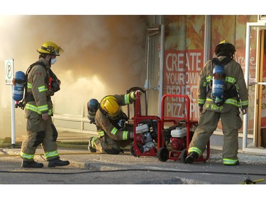 Members of the Calgary Fire Department worked to extinguish a two alarm fire at the Stadium Shopping Centre on Nov. 12, 2015.