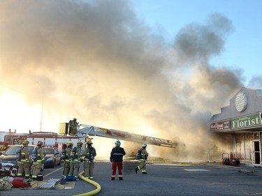 Members of the Calgary Fire Department worked to extinguish a two alarm fire at the Stadium Shopping Centre on November 12, 2015.