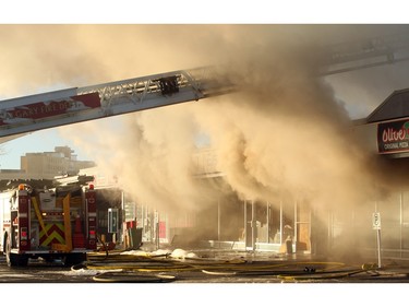 Members of the Calgary Fire Department worked to extinguish a two alarm fire at the Stadium Shopping Centre on Nov. 12, 2015.