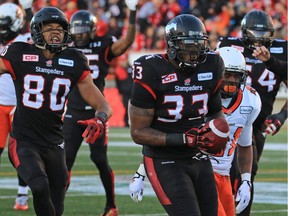 Calgary Stampeders running back Jerome Messam runs the ball in for a touchdown during the first half of the CFL's West Division semifinal against the B.C. Lions at McMahon Stadium. He was too much for the Lions defence to handle all day.