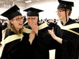 Juanita Marshall, 55, gets ready to graduate with a degree in social work from at the University of Calgary on November 12, 2015 along with her two daughters Natashia Marshall, 27, left and Sarah Jane Marshall, 30.