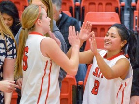 SAIT Trojans women's basketball stars Kendell Kuntz, left, and Alicia Tan have combined for more than 33 points a game this season.
