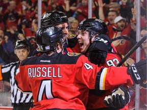 Sam Bennett of the Calgary Flames, right, celebrates after scoring the game-winning goal against the Pittsburgh Penguins on Saturday night.