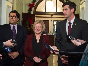 Premier Rachel Notley with Calgary mayor Naheed Nenshi (left) and Edmonton Mayor Don Iveson in the hallway outside the premier's office in Edmonton, Nov. 18, 2015.